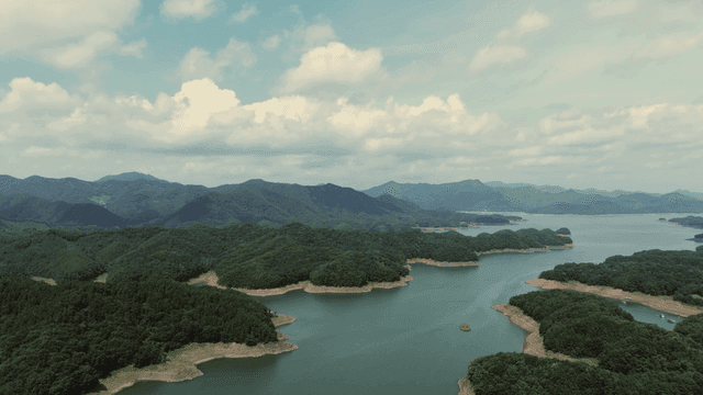 Vast lake surrounded by lush mountains