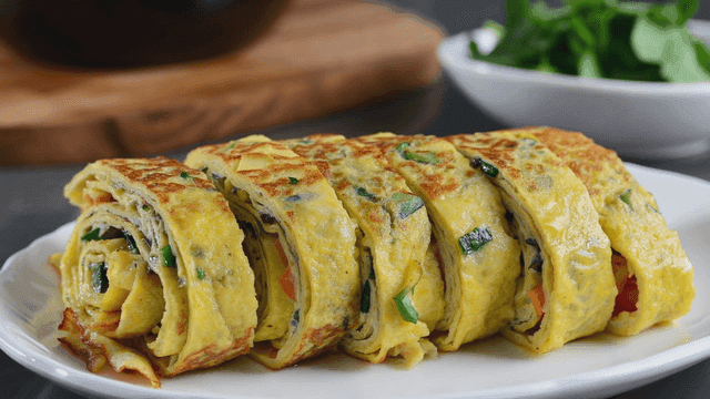 Thick rolled omelet on plate