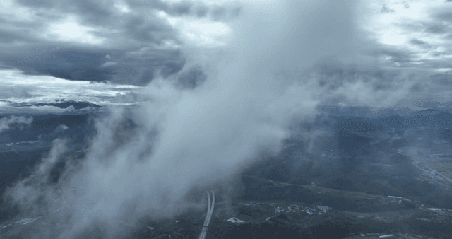 Clouds over a mountainous landscape