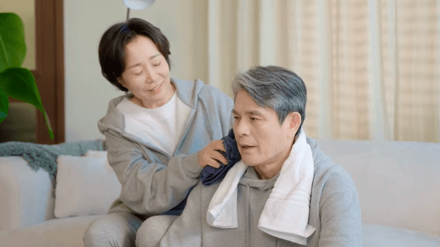 Couple relaxing on a sofa indoors