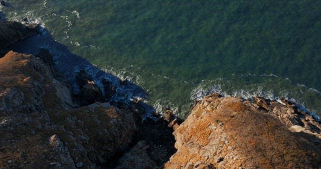 Serene Coastal Cliffs with Gentle Waves