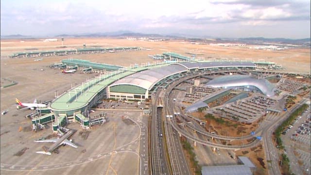 Bustling Incheon airport with multiple parked aircraft