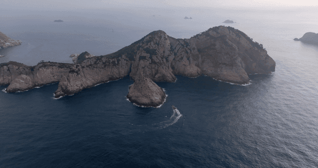 A rocky island surrounded by the sea
