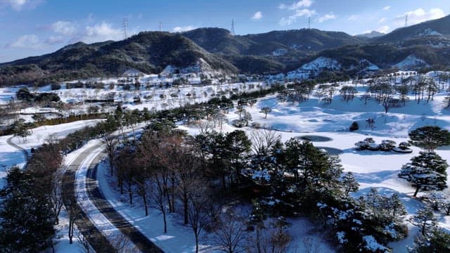 Snowy Winter Landscape with Mountains and Trees