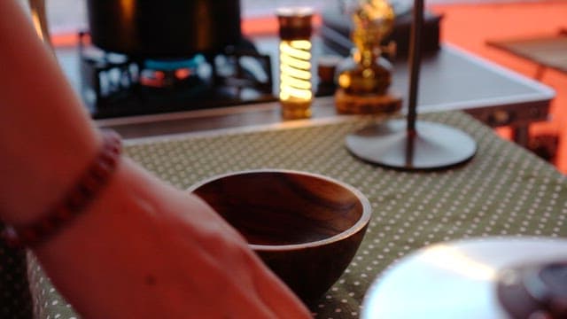 Preparing kimchi in a wooden bowl on a cozy table