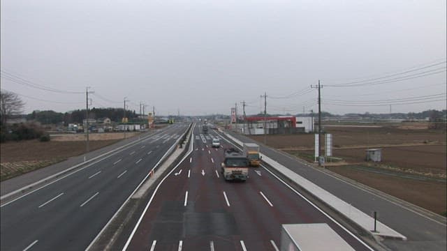 Roads clogged with trucks and cars on a cloudy day