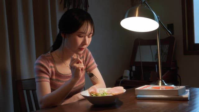 Woman enjoying a meal indoors