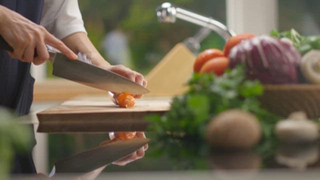 Slicing Fresh Vegetables on a Cutting Board