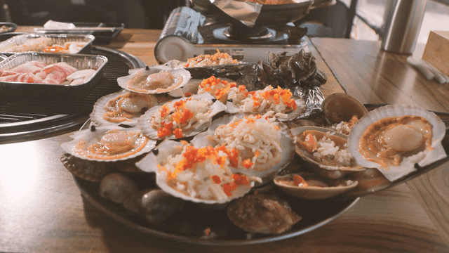 Variety of grilled shellfish on table