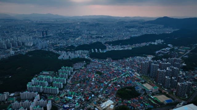 Sprawling city with surrounding mountains