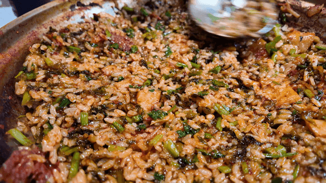 Ladle to press fried rice into pan