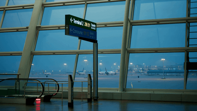 Airport terminal with planes visible outside