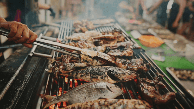 Grilled seafood sizzling on a barbecue