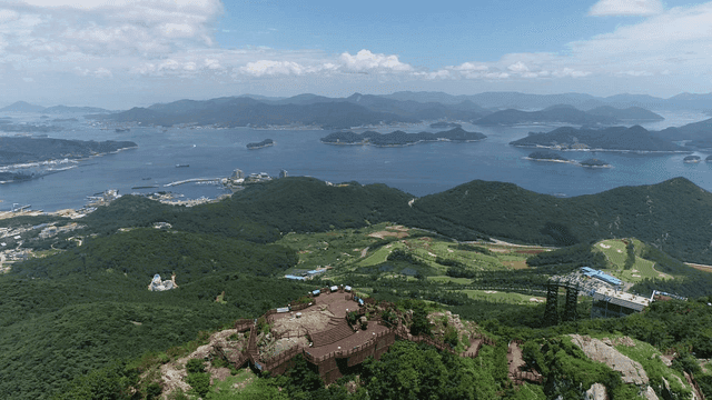 Mountain top view with town and sea