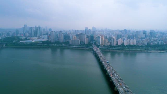 Tranquil Han River and Complex Cityscape