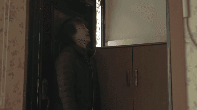 Man comes into the house with a dark expression and sits down