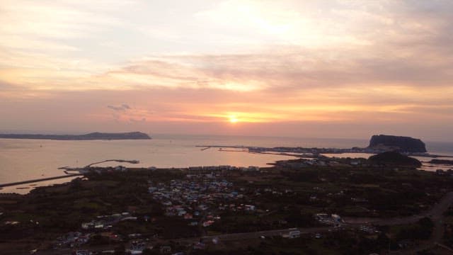 Sunset over a coastal town and sea