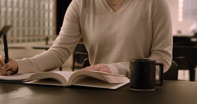 Student Studying in a Quiet Cafe