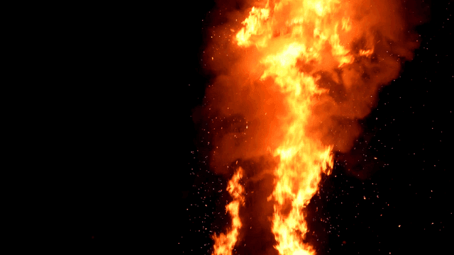 Large bonfire burning brightly at night