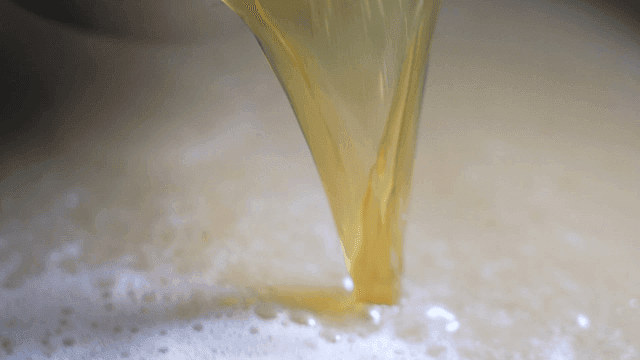 Pouring broth into a pot