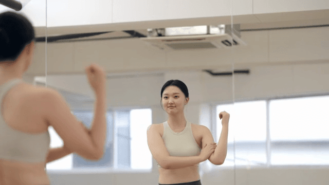 Woman stretching in a fitness studio