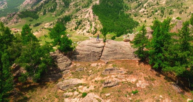 Person standing on a rocky mountain