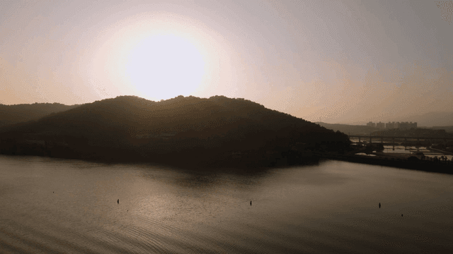 Sunset over a tranquil lake and hills