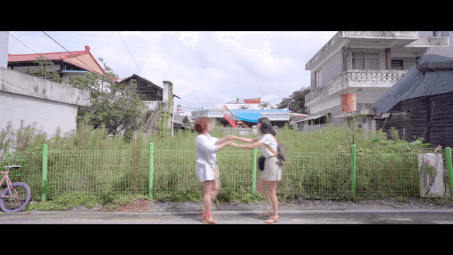 Two friends meeting on a quiet street