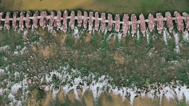 Stone bridge across the river viewed from above
