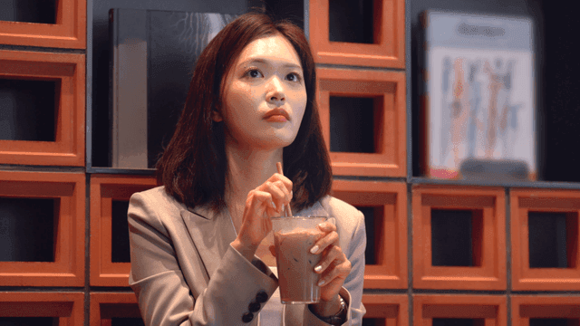 Working woman drinking iced coffee