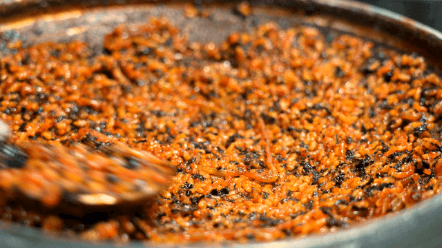 Spicy fried rice mixed in pan