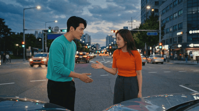 Two people arguing after a car accident