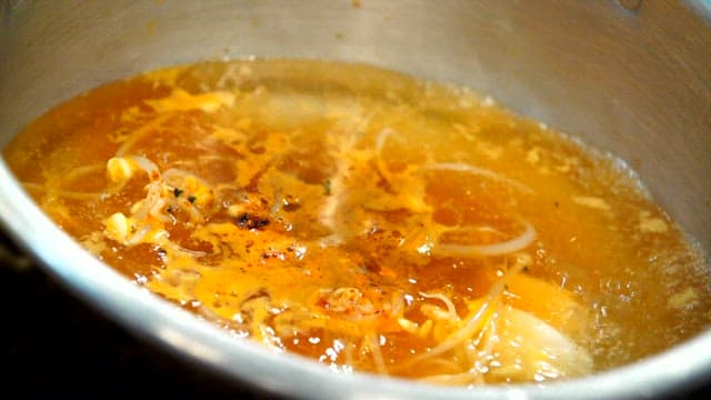 Ramen noodles cooking in a pot