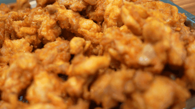 Crispy fried chicken on metal tray