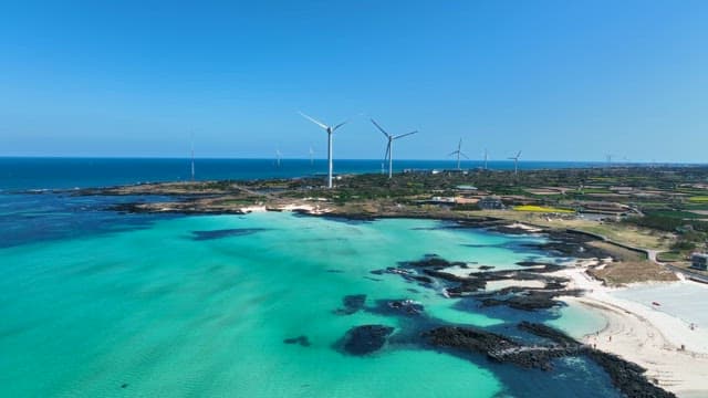 Coastal landscape with wind turbines