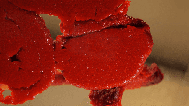 Thick red pepper paste scooped out with spatula