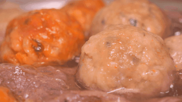 Rolled dumpling hot pot simmering in rich broth