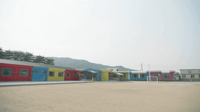 Colorful elementary schools lined up in rows