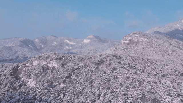 Snow-covered mountains under a clear sky
