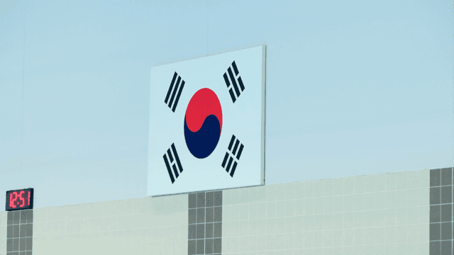 Taegeukgi displayed next to digital clock