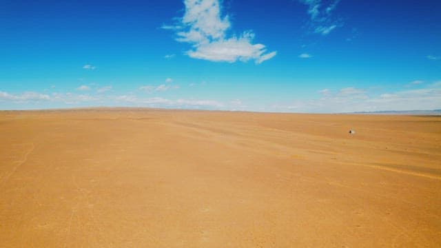 Vast Desert Landscape Under a Blue Sky