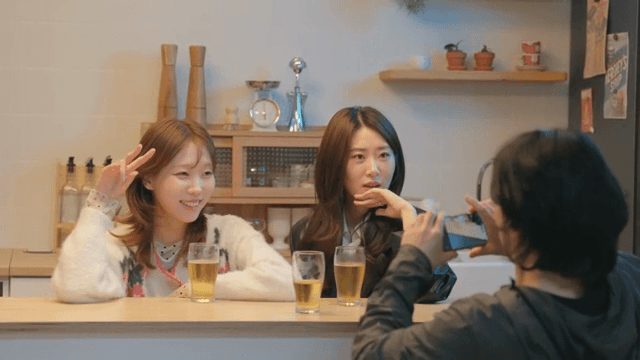 Friends taking selfies while drinking beer
