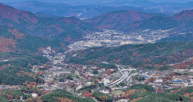 Rural village surrounded by autumn mountains