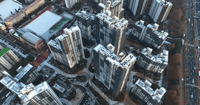 Snow-covered tall apartments
