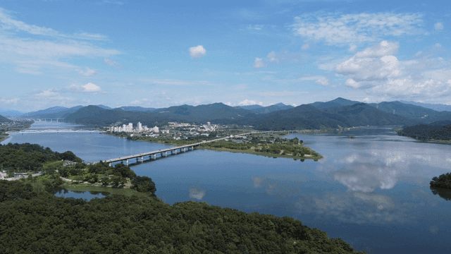 Scenic river with bridges and mountains