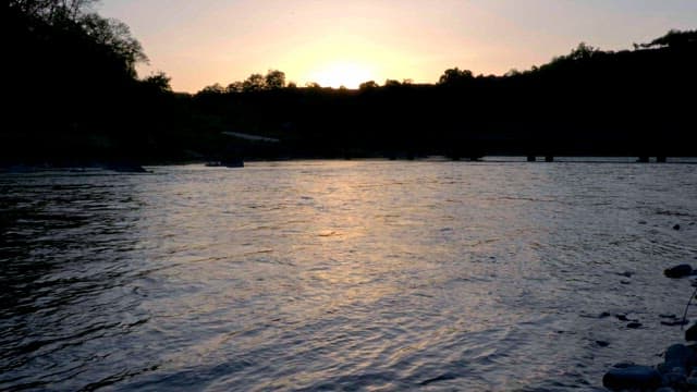 Serene river at sunset