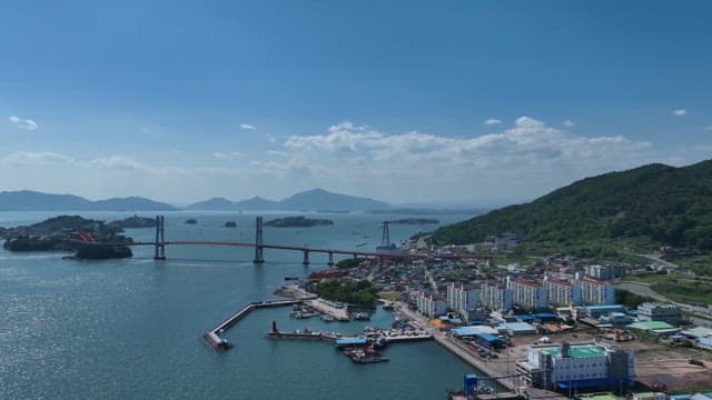 Coastal city town a bridge and mountains