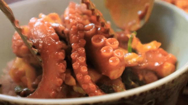Spicy stir-fried octopus in a bowl