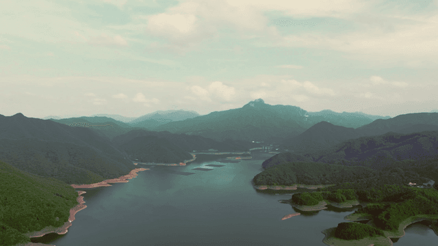 Tranquil lake surrounded by mountains