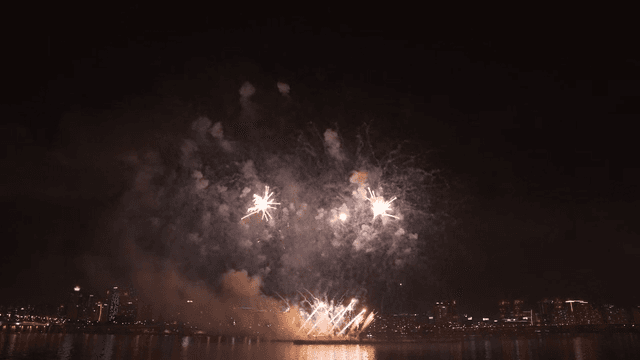 Fireworks display over a city skyline